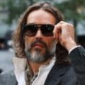 Russell Brand appears in court for start of rape trial